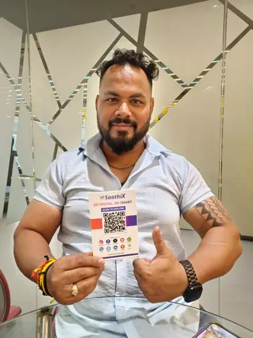 Salon owner showing a SaathiX QR card
